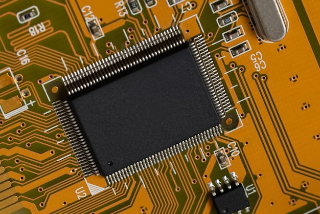 Fragment of lectronic circuit board from a computer on a white background