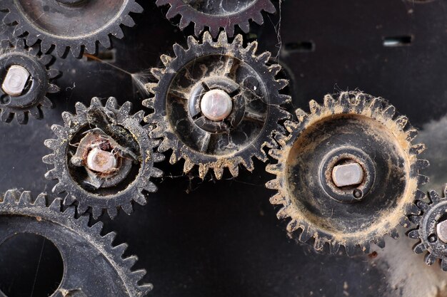 Photo fragment of the machine plastic dusty and dirty gears