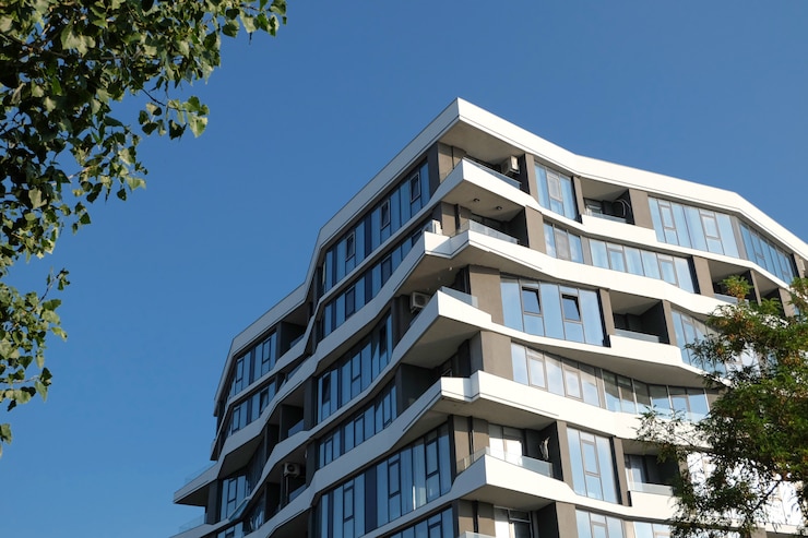 Photo fragment of a modern building against blue sky. real estate.