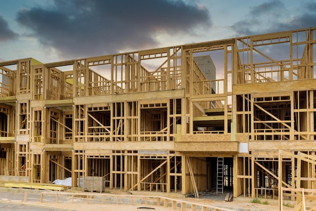 Fragment of a new home under construction wood framing beams framework