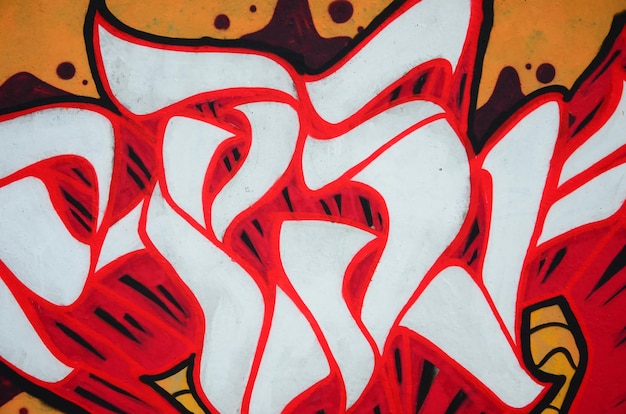 Фото fragment of colored street art graffiti paintings with contours and shading close up background