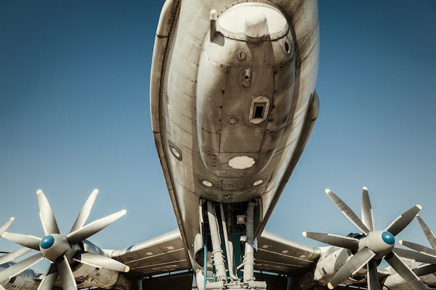 Fragment of old airplane. Engines on wings