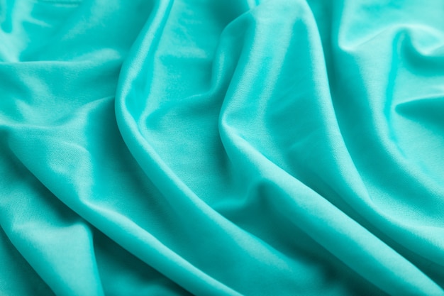 Photo fragment of silk blue tissue.