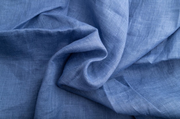 Fragment van blauw linnen weefsel Bovenaanzicht natuurlijke textiel achtergrond