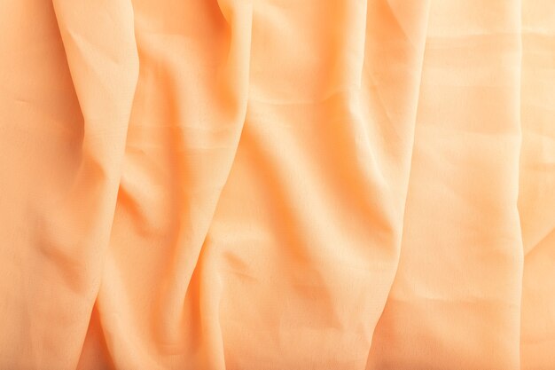 Fragment van oranje linnen tissue