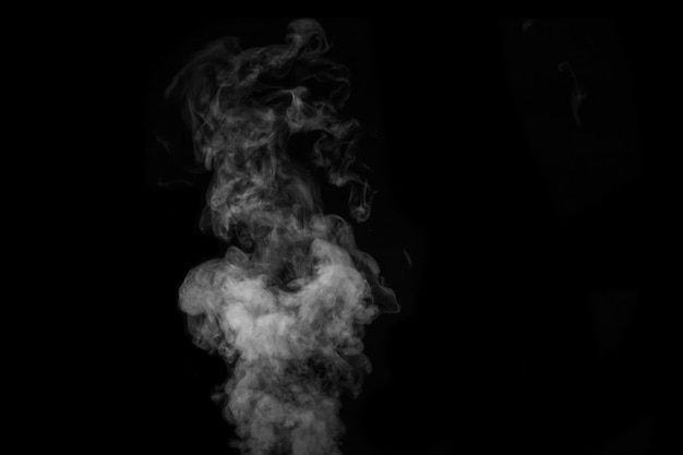 Fragment of white hot curly steam smoke isolated on a black background, close-up. Create mystical Halloween photos. Abstract background, design element