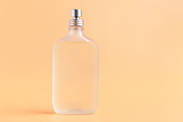 Fragrance bottles close up on a light beige 