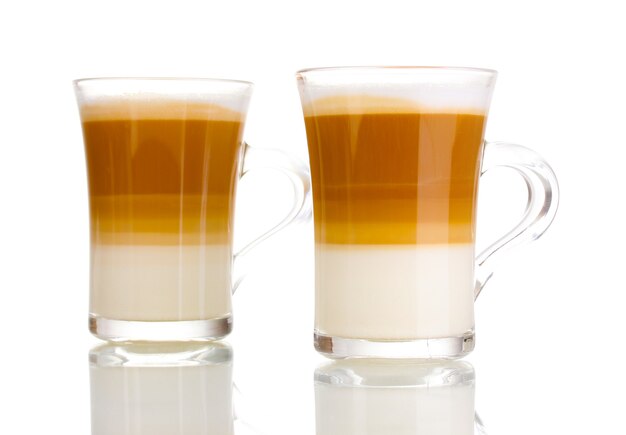 Fragrant coffee latte in glass cups on white