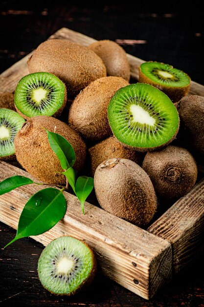 Fragrant kiwi with leaves on tray