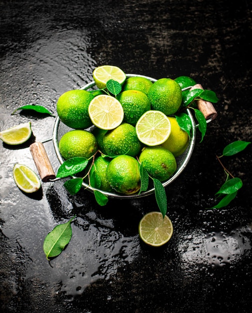 Fragrant lime with leaves in a colander