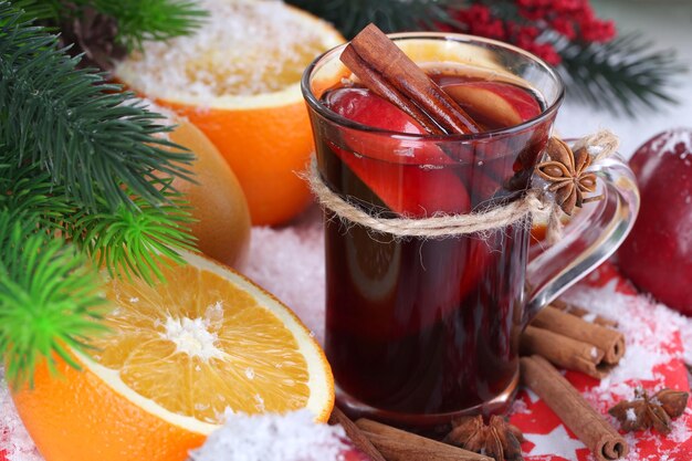 Fragrant mulled wine in glass on napkin close-up