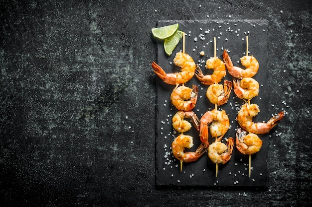 Fragrant shrimps grilled on a stone Board