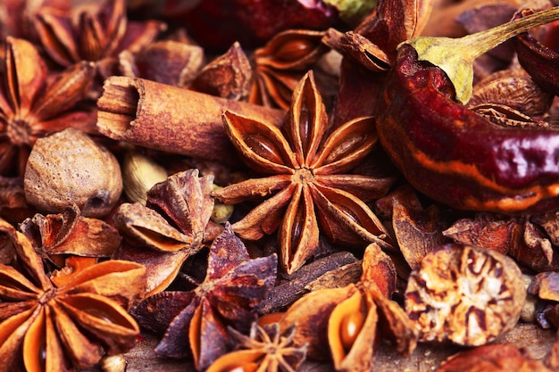 Fragrant spices on a wooden background