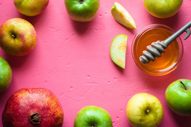 Photo frame of apples pomegranate and honey for the jewish new year horizontal