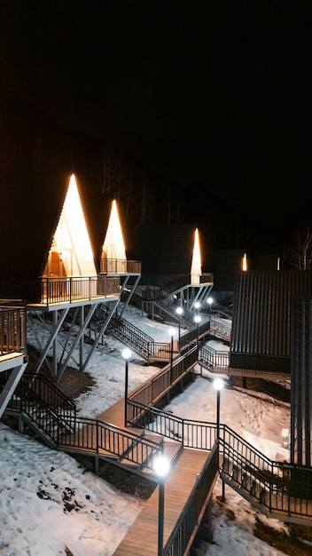 A Frame cabins at night in the winter park