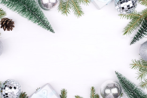 Frame of Christmas decorations on a white