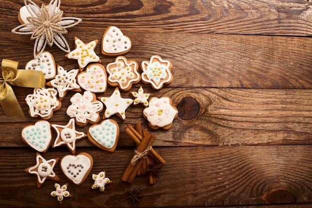 Frame of christmas sweet cookies on dark brown wooden background Top view and copy space Mock up Happy new year concept