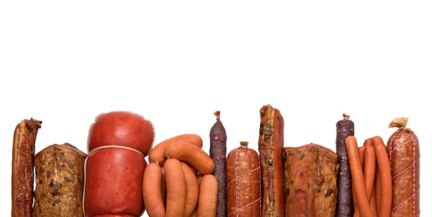 Frame of different sausages isolated on white background top\
view meatworks product photo