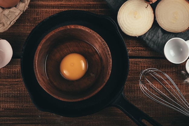 frame of food ingredients and utensils for cookingfrom top view wooden background