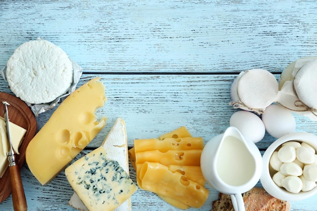 Frame of fresh dairy products on blue wooden table