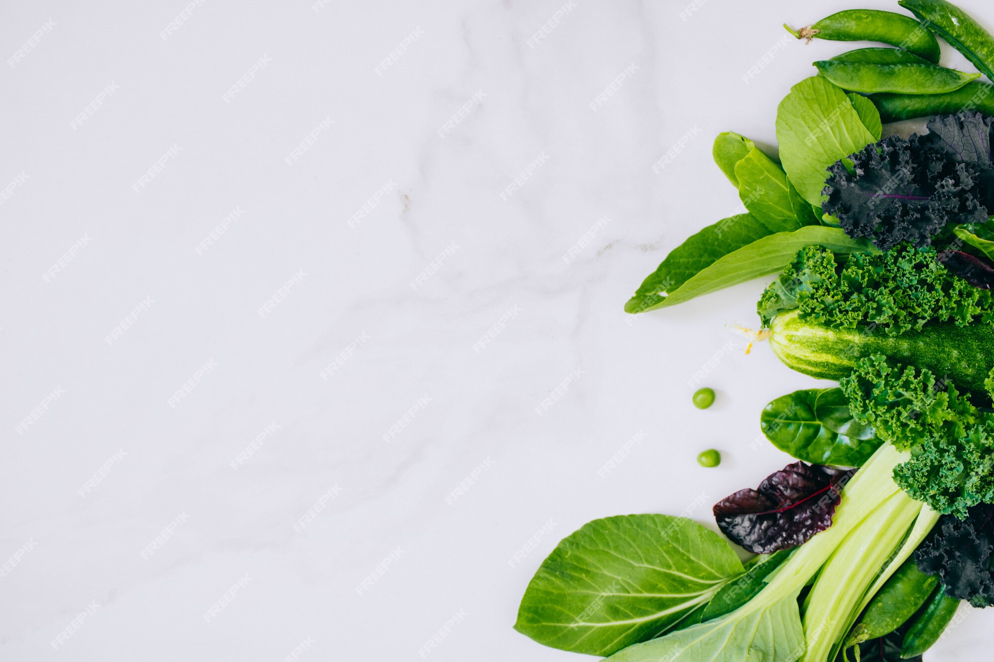 Premium Photo | Frame of fresh green vegetables on a marble background