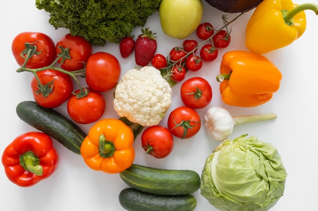 Frame of fresh vegetables and fruits isolated on white background