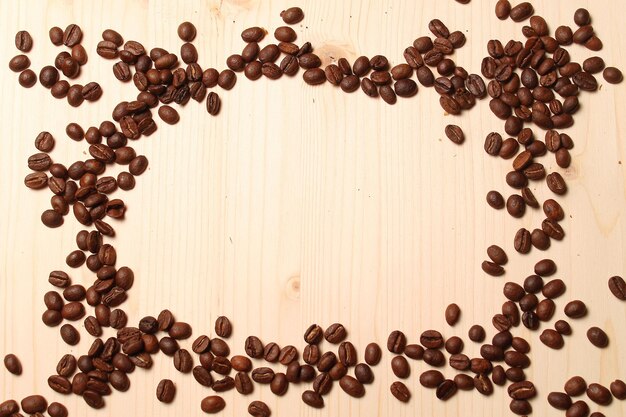 Frame from coffee beans on the table