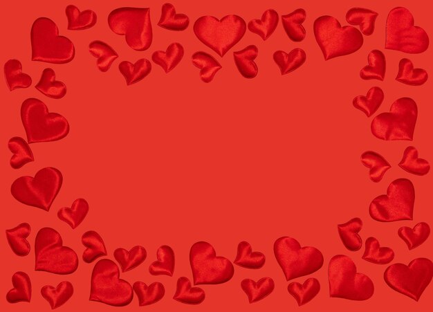 Frame from hearts on red background. symbol of 14 February. happy valentines day