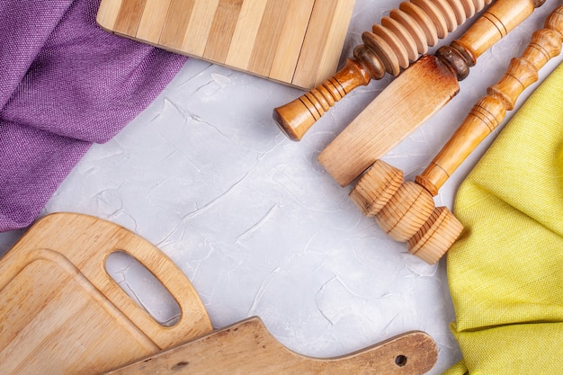 Frame from wood boards, fabric and rural kitchen utensils