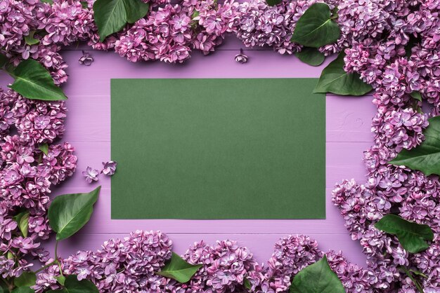 Frame of lilac flowers and space for text