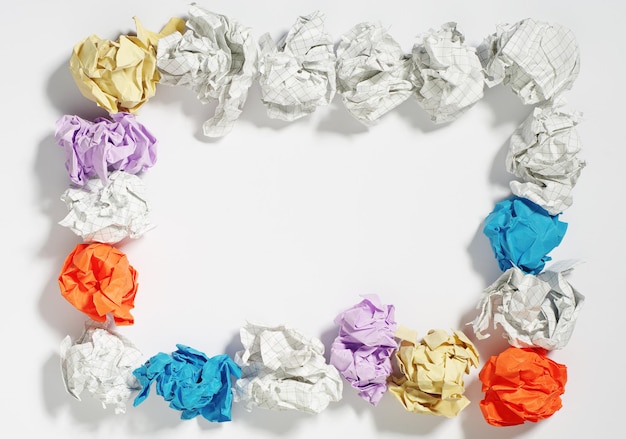 Frame made of colored balls of crumpled paper on white background. Conceptual photo