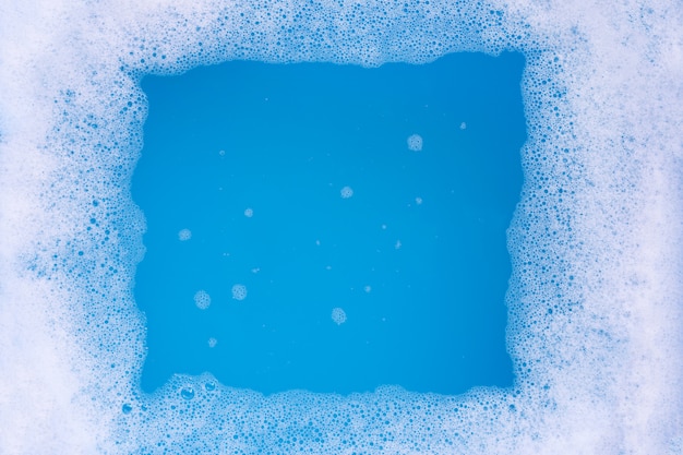 Frame made of detergent foam bubble. Blue.