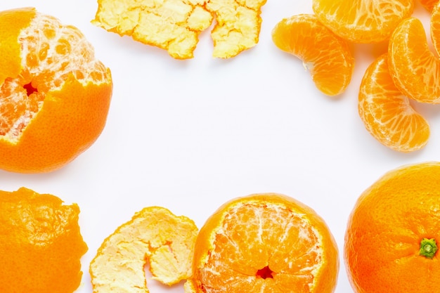 Frame made of fresh orange citrus fruit isolated on white background.