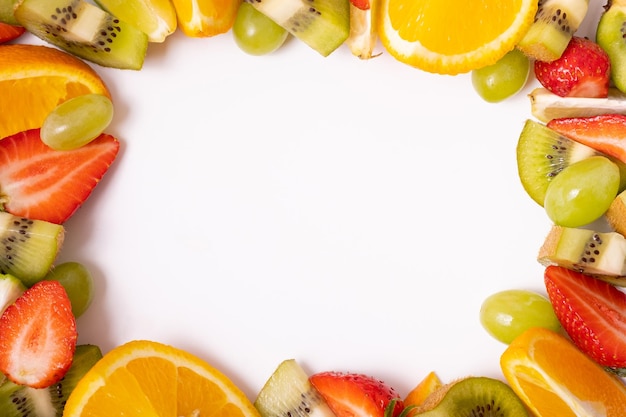 Frame made from citrus fruits and strawberries composition with copy space flat lay top view