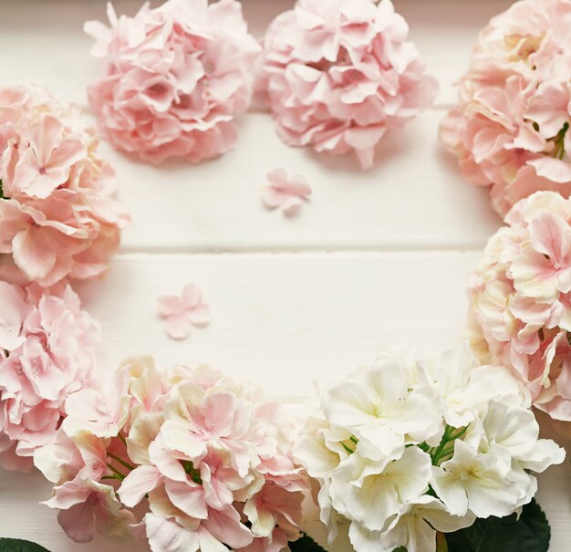 Photo frame made of pink and beige hydrangea flowers