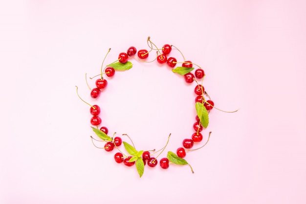 Photo frame made of sweet cherries