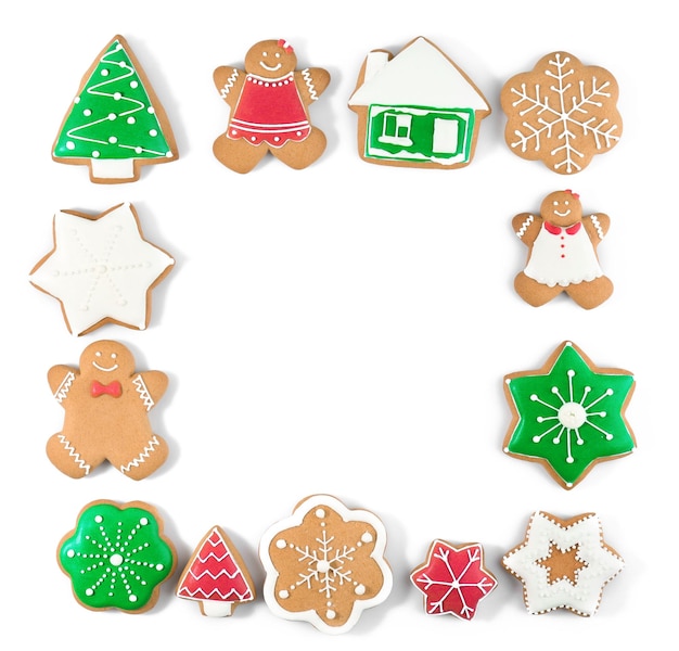 Frame made of tasty Christmas cookies on white background