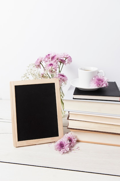 Photo frame mock-up next to books