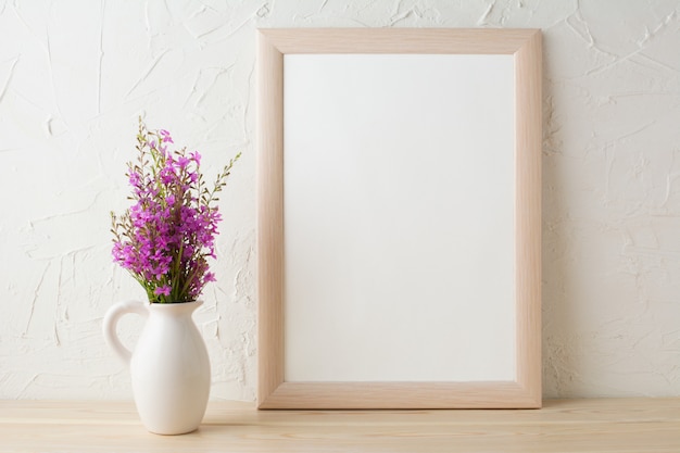 Frame mockup with purple wild flowers bouquet