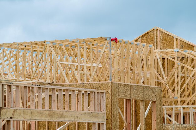 Photo frame of a plywood house close up plank unfinished residential