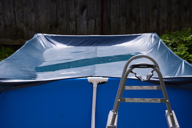 Frame pool on the lawn in the garden