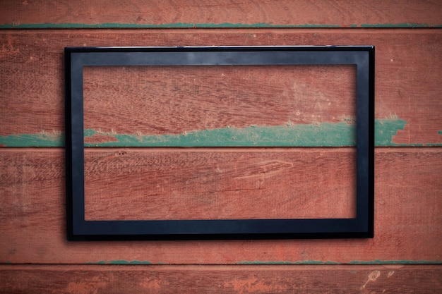 Photo frame of screen on wooden.