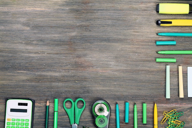 Frame of stationery on wooden background