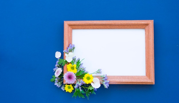 Frame for texat decorated with flowers on a blue background