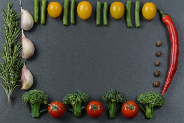 Photo frame of vegetables. black background banner with vegetables