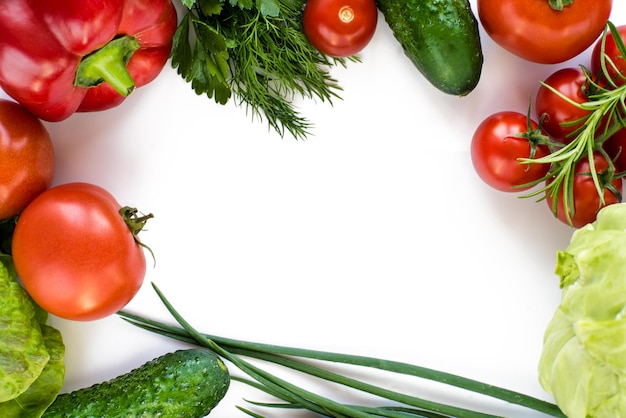 A frame of vegetables on a white background