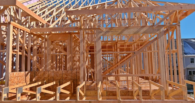 Framing of under construction wooden house building frame structure on a new development