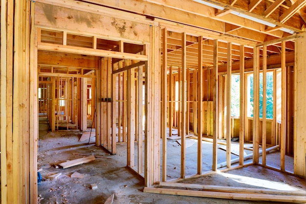 Photo framing of under construction wooden house building frame structure on a new development