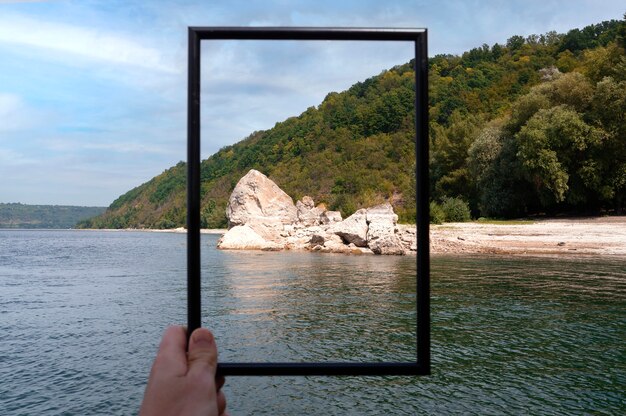 Photo framing landscape while traveling