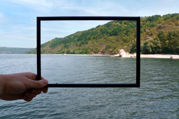 Photo framing landscape while traveling